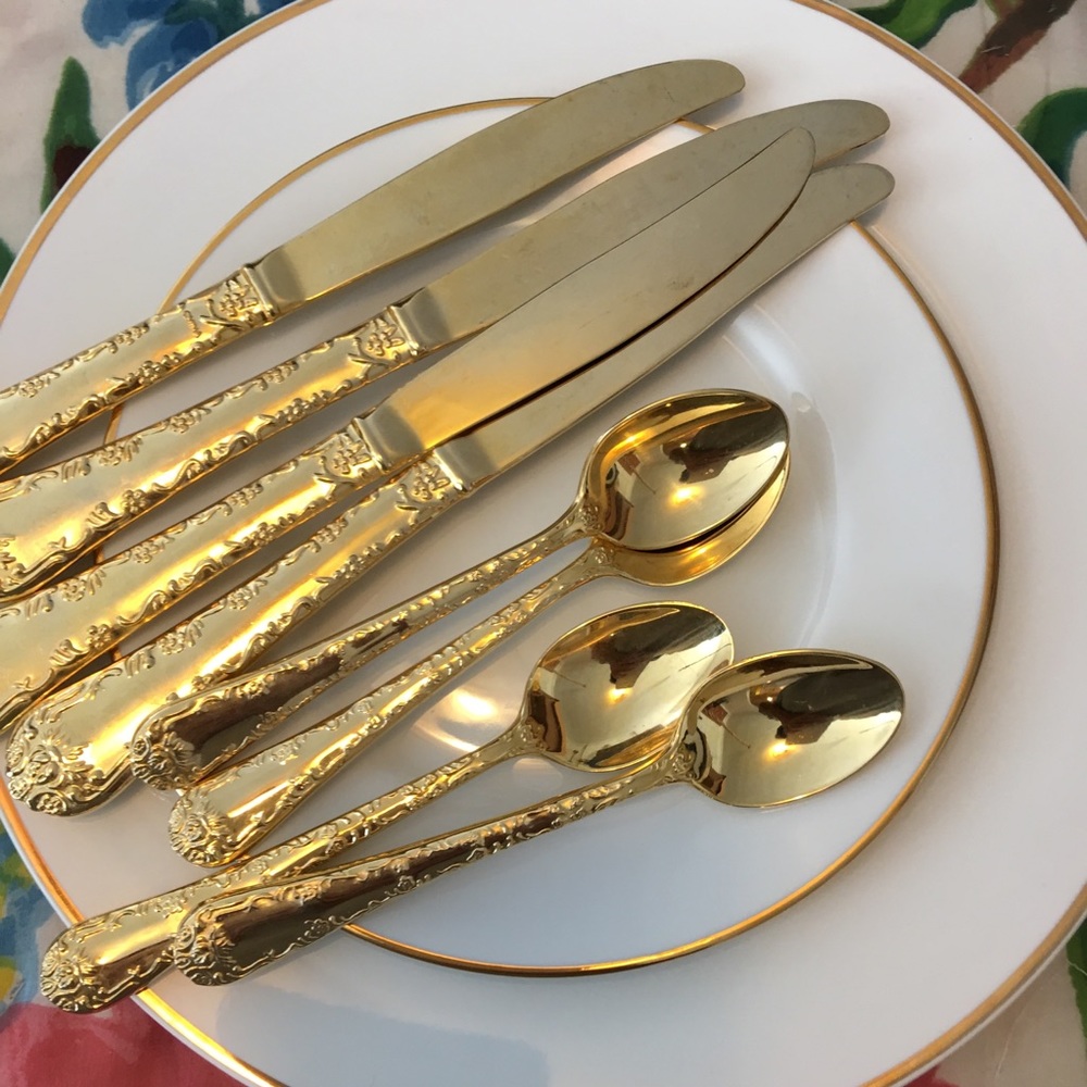 Gold tone spoons and  knives